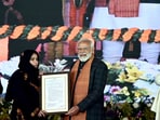 Prime Minister Narendra Modi distributed appointment letter during the launch of various projects and a public rally,at Bakshi Stadium in Srinagar last month.