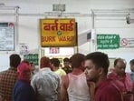 Relatives and family members outside the burn ward of a hospital where the people who were injured in a fire that broke out in the Mahakal temple are being treated in Ujjain. (PTI) (File)