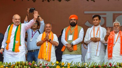 Home Minister Amit Shah waves to supporters during a public meeting in support of BJP candidate from Aurangabad constituency Sushil Kumar Singh, in Aurangabad, Bihar. (PTI) Home Minister Amit Shah waves to supporters during a public meeting in support of BJP candidate from Aurangabad constituency Sushil Kumar Singh, in Aurangabad, Bihar. (PTI)