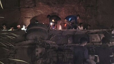 A bus full of workers overturned in a mine in Durg, on Tuesday. The process of evacuating the people trapped in the bus is underway. (ANI Photo) (ANI) A bus full of workers overturned in a mine in Durg, on Tuesday. The process of evacuating the people trapped in the bus is underway. (ANI Photo) (ANI)