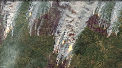 Satellite image shows wildfires in British Columbia and Alberta, Canada (via REUTERS)