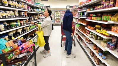 People shop in the food section of a retail store in Rosemead, California. (AFP) People shop in the food section of a retail store in Rosemead, California. (AFP)