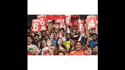 Fans cheering for Punjab Kings during their match against Sunrisers Hyderabad at the Mullanpur cricket stadium in Chandigarh on Tuesday. SRH won the match by two runs. (HT Photo)