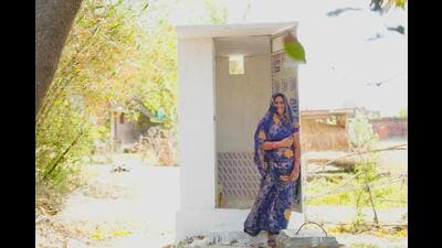 Fifty-year-old Snehlata from Sardarnagar, Gorakhpur celebrates the inauguration of the new twin-pit toilet in her house. (HT Photo) Fifty-year-old Snehlata from Sardarnagar, Gorakhpur celebrates the inauguration of the new twin-pit toilet in her house. (HT Photo)