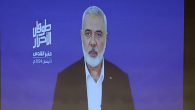 Hamas chief Ismail Haniyeh speaks in a pre-recorded message shown on a screen during an event ahead of al-Quds (Jerusalem) Day on Friday April 5, in Beirut, Lebanon April 3, 2024. REUTERS/Mohamed Azakir (REUTERS)