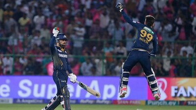 Gujarat Titans' Rashid Khan, left, and teammate Noor Ahmad celebrate their team's victory during the Indian Premier League cricket match against Rajasthan Royals in Jaipur. (AP) Gujarat Titans' Rashid Khan, left, and teammate Noor Ahmad celebrate their team's victory during the Indian Premier League cricket match against Rajasthan Royals in Jaipur. (AP)