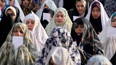 Iranian worshippers perform Eid-ul-Fitr prayer in Tehran, Iran on Wednesday. (AP) Iranian worshippers perform Eid-ul-Fitr prayer in Tehran, Iran on Wednesday. (AP)
