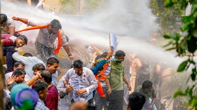 Security personnel use water cannon to disperse BJP workers protesting against AAP convener and Delhi CM Arvind Kejriwal, outside AAP office in New Delhi. (PTI) Security personnel use water cannon to disperse BJP workers protesting against AAP convener and Delhi CM Arvind Kejriwal, outside AAP office in New Delhi. (PTI)