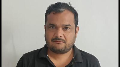 Ravi Atri in UP special task force custody on Wednesday. (HT Photo) Ravi Atri in UP special task force custody on Wednesday. (HT Photo)
