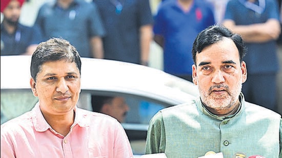 Delhi ministers Saurabh Bharadwaj and Gopal Rai after visiting Kejriwal’s residence on Wednesday. (ANI)