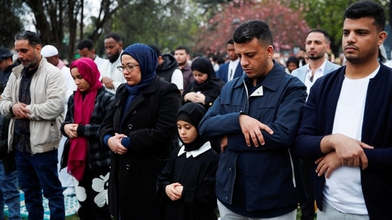 People attend Eid al-Fitr prayers, marking the end of the fasting month of Ramadan, outside the Hagia Sophia Grand Mosque in Istanbul, Turkey on Wednesday.(REUTERS)