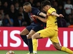 Kylian Mbappe and Pau Cubarsi fight for the ball. Kylian Mbappe and Pau Cubarsi fight for the ball.