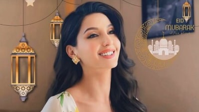 Nora Fatehi posted a picture of herself smiling as she dressed in a printed white suit. The edited photo had "Eid Mubarak" written on it. Nora Fatehi posted a picture of herself smiling as she dressed in a printed white suit. The edited photo had "Eid Mubarak" written on it.