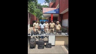 Accused Ankush Kumar, 29, and the recovered articles in the custody of Chandigarh Police on Thursday. (HT Photo) Accused Ankush Kumar, 29, and the recovered articles in the custody of Chandigarh Police on Thursday. (HT Photo)