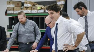 Canadian Prime Minister Justin Trudeau (right), tours a modular home construction facility before making a housing announcement in Calgary, Alberta, on April 5. (AP) Canadian Prime Minister Justin Trudeau (right), tours a modular home construction facility before making a housing announcement in Calgary, Alberta, on April 5. (AP)