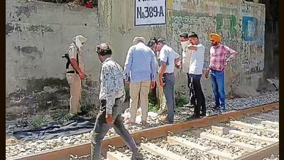 Cops at the crime scene near the railway track in Sherpur area, Ludhiana, on Thursday. (HT Photo) Cops at the crime scene near the railway track in Sherpur area, Ludhiana, on Thursday. (HT Photo)