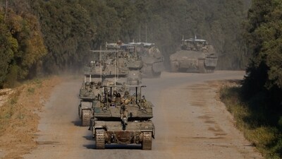Israeli tanks and armoured personnel carriers (APC) manoeuvre on their way to Gaza, amid the ongoing conflict between Israel and the Palestinian Islamist group Hamas, near the Israel-Gaza border, in Israel, April 10, 2024. (REUTERS)