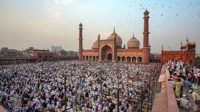 Devotees assemble to offer 'namaz' at Jama Masjid on the occasion of the Eid-ul-Fitr festival in New Delhi on Thursday. (PTI)
