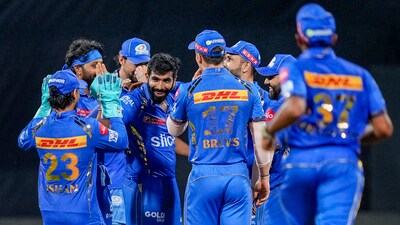 Mumbai Indians player Jasprit Bumrah with his teammates celebrates the wicket of Royal Challengers Bengaluru's player Vijaykumar Vyshak (PTI) Mumbai Indians player Jasprit Bumrah with his teammates celebrates the wicket of Royal Challengers Bengaluru's player Vijaykumar Vyshak (PTI)