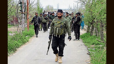 Security personnel patrol an area after an encounter in Pulwama on Thursday (ANI)