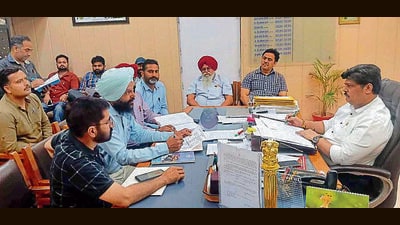 Teachers’ delegation discussing their issues with Ludhiana ADC Amit Sareen on Thursday. (HT Photo)