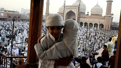 Delhi's Jama Masjid witnesses joyful scenes as children embrace and exchange Eid greetings after offering Namaz. Eid-ul-Fitr festivities bring together families and communities in celebration. (Sanjeev Verma/HT Photo)