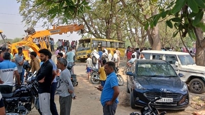 School bus that overturned in Haryana's Mahendergarh on Thursday morning. (HT Photo) School bus that overturned in Haryana's Mahendergarh on Thursday morning. (HT Photo)
