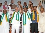 B. S. Yediyurappa, along with son Vijayendra, HD Kumaraswamy, BS Bommai, and Deve Gowda.