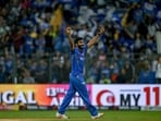 Mumbai Indians' Jasprit Bumrah celebrates after taking a wicket.