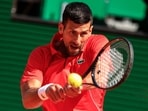 Serbia's Novak Djokovic plays a backhand return.