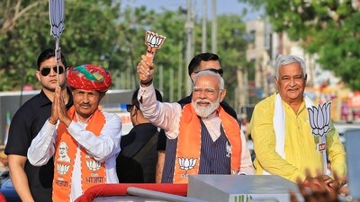 PM Narendra Modi with Rajasthan minister Kirodi Lal Meena during a roadshow in support of BJP candidate from Dausa, Kanhiya Lal Meena, in Dausa district, Rajasthan. (PTI) PM Narendra Modi with Rajasthan minister Kirodi Lal Meena during a roadshow in support of BJP candidate from Dausa, Kanhiya Lal Meena, in Dausa district, Rajasthan. (PTI)