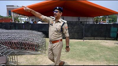A Gautam Budh Nagar police officer checking security arrangement outside the venue where Home minister Amit Shah is set to address a public rally in Noida. (Sunil Ghosh/HT Photo) A Gautam Budh Nagar police officer checking security arrangement outside the venue where Home minister Amit Shah is set to address a public rally in Noida. (Sunil Ghosh/HT Photo)