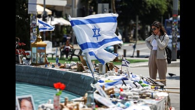 A woman looks at memorabilia and pictures of the hostages kidnapped in the deadly October 7 attack on Israel by the Palestinian Islamist group Hamas from Gaza, at Dizengoff Square in Tel Aviv on April 11 (REUTERS) A woman looks at memorabilia and pictures of the hostages kidnapped in the deadly October 7 attack on Israel by the Palestinian Islamist group Hamas from Gaza, at Dizengoff Square in Tel Aviv on April 11 (REUTERS)