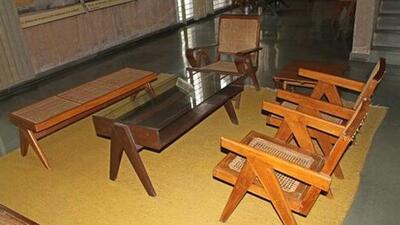 An occasional table, a coffee table, a set of eight office cane chairs were among the heritage items from Chandigarh auctioned. (HT File)