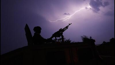 Lightning illuminates the sky behind the gunner on a Thai military armored vehicle, as he keeps watch along the Moei river in Mae Sot in Thailand's Tak province on Friday. Thailand's foreign minister has urged Myanmar's military authorities not to violently respond to its army's loss of an important border trading town to its opponents, and that so far it seems to be exercising restraint. (AP) Lightning illuminates the sky behind the gunner on a Thai military armored vehicle, as he keeps watch along the Moei river in Mae Sot in Thailand's Tak province on Friday. Thailand's foreign minister has urged Myanmar's military authorities not to violently respond to its army's loss of an important border trading town to its opponents, and that so far it seems to be exercising restraint. (AP)