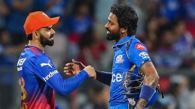 Mumbai Indians captain Hardik Pandya and Royal Challengers Bengaluru's player Virat Kohli exchange greetings after the IPL 2024 cricket match against Royal Challengers Bengaluru and Mumbai Indians at Wankhede Stadium (PTI)