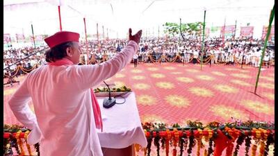 Samajwadi Party chief Akhilesh Yadav addresses an election rally organized in support of party candidate from Pilibhit constituency Bhagwat Sharan Gangwar (unseen) ahead of the Lok Sabha polls, in Pilibhit on Friday. (ANI Photo)