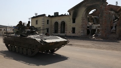 Ukrainian servicemen drive an infantry fighting vehicle (IVF) past the destroyed railway station in the town of Kostyantynivka, Donetsk region, on April 11, 2024, amid the Russian invassion in Ukraine. (Photo by Anatolii STEPANOV / AFP) (AFP) Ukrainian servicemen drive an infantry fighting vehicle (IVF) past the destroyed railway station in the town of Kostyantynivka, Donetsk region, on April 11, 2024, amid the Russian invassion in Ukraine. (Photo by Anatolii STEPANOV / AFP) (AFP)