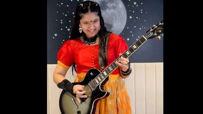 Maya Neelakantan performing Slayer's song on her guitar. Maya Neelakantan performing Slayer's song on her guitar.