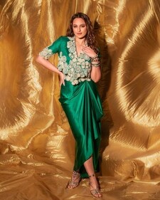 Sonakshi Sinha in a green cropped jacket and a satin skirt featuring dramatic draping. (Photo: Instagram) Sonakshi Sinha in a green cropped jacket and a satin skirt featuring dramatic draping. (Photo: Instagram)