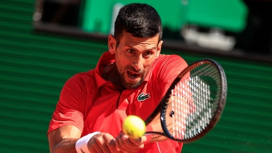 Serbia's Novak Djokovic plays a backhand return. (AFP)