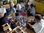 Workers pack indelible ink vials that are used during elections to prevent duplication of voting, at the government-run Mysore Paints and Varnish company in Mysuru, India, March 12, 2024. REUTERS/Rakesh Nair