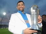 MS Dhoni with the Champions Trophy title in 2013 MS Dhoni with the Champions Trophy title in 2013