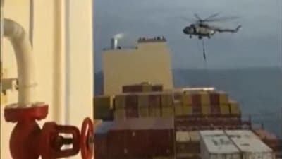 This image grab taken from a UGC video posted on social media on April 13, 2023, shows Iran's Revolutionary Guards rappelling down onto a container ship named, MSC Aries, near the Strait of Hormuz. (AFP) This image grab taken from a UGC video posted on social media on April 13, 2023, shows Iran's Revolutionary Guards rappelling down onto a container ship named, MSC Aries, near the Strait of Hormuz. (AFP)