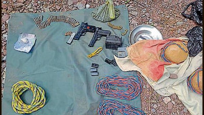 The arms, ammo and explosives recovered from the terror hideout in Reasi’s Lancha area on Saturday (ANI)