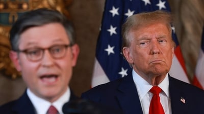 Former US President Donald Trump listens as Speaker of the House Mike Johnson (R-LA) speaks during a press conference at Mr. Trump's Mar-a-Lago estate on April 12, 2024, in Palm Beach, Florida. They spoke about "election integrity," which has been one of the former president's top issues. (Photo by JOE RAEDLE / GETTY IMAGES NORTH AMERICA / Getty Images via AFP) (Getty Images via AFP)