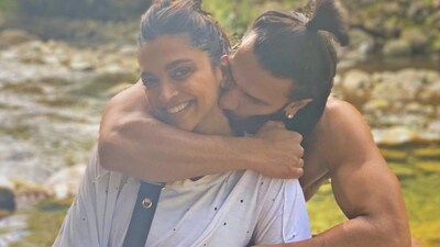 This picture is from one of Deepika and Ranveer's first vacations as a married couple. They seem to be chilling near a waterfall with lots of greenery all around. This picture is from one of Deepika and Ranveer's first vacations as a married couple. They seem to be chilling near a waterfall with lots of greenery all around.