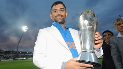 MS Dhoni with the Champions Trophy title in 2013 MS Dhoni with the Champions Trophy title in 2013