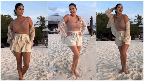 Sunny Leone gives major summer vibes in a beige tank top, linen shorts and an oversized checkered shirt. (Instagram/@sunnyleone)