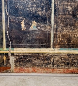 This image shows a fresco depicting the Greek mythology figures Cassandra, right, a cursed prophetess, and Apollo, God of oracles and knowledge, inside an imposing banquet hall. (AP) This image shows a fresco depicting the Greek mythology figures Cassandra, right, a cursed prophetess, and Apollo, God of oracles and knowledge, inside an imposing banquet hall. (AP)